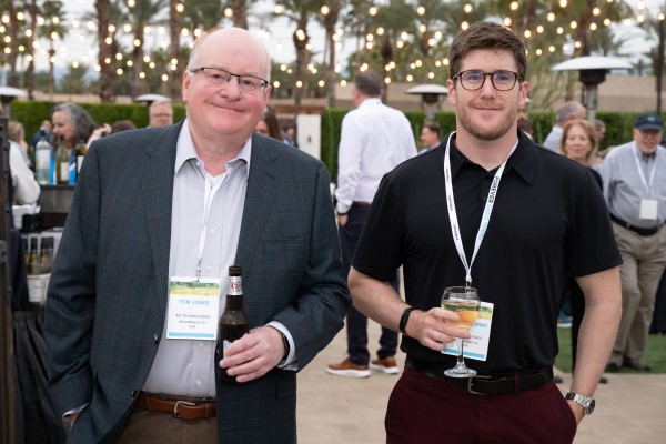 2 attendees posing for a welcome rarty photo