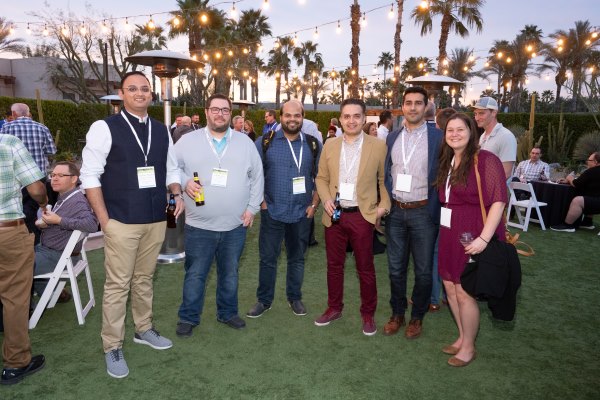 Group of 6 attendees posing for a group photo