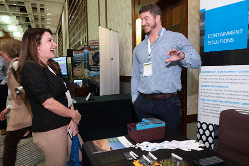 Sponsor and Attendee discussing products at GWMS